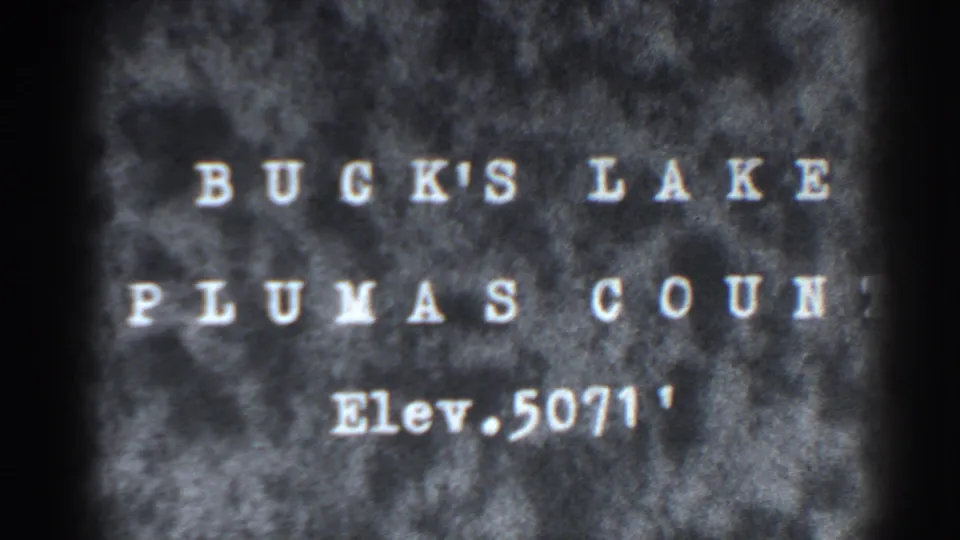 End frame of the 1938 Bucks Lake title card, with the elevation line visible in soft 8mm focus.