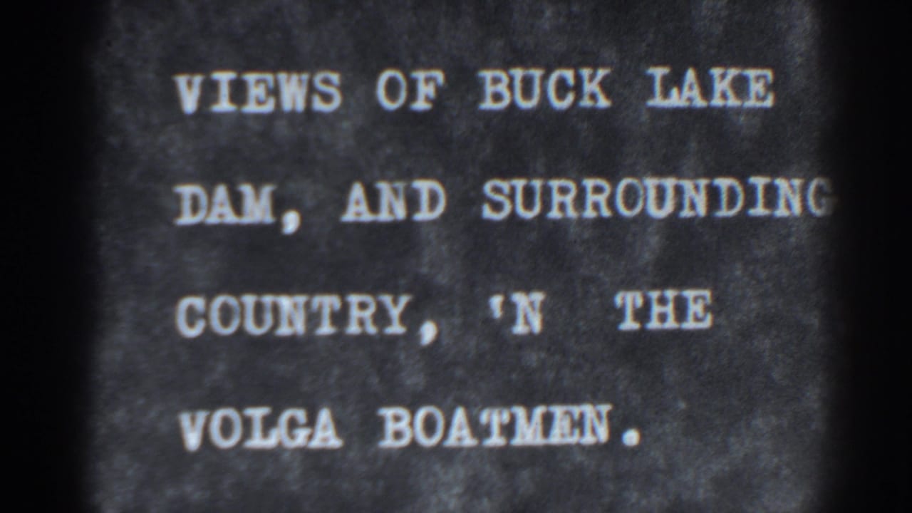1938 8mm title card for Bucks Lake Dam and surrounding country, shown as white lettering on a dark textured background.