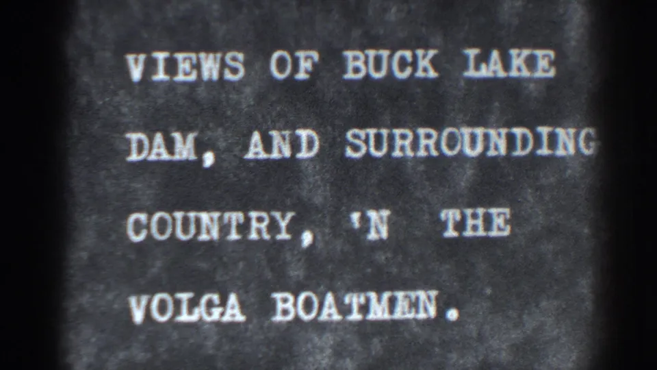 Archival 8mm title frame naming Bucks Lake Dam, surrounding country, and the Volga Boatmen segment.