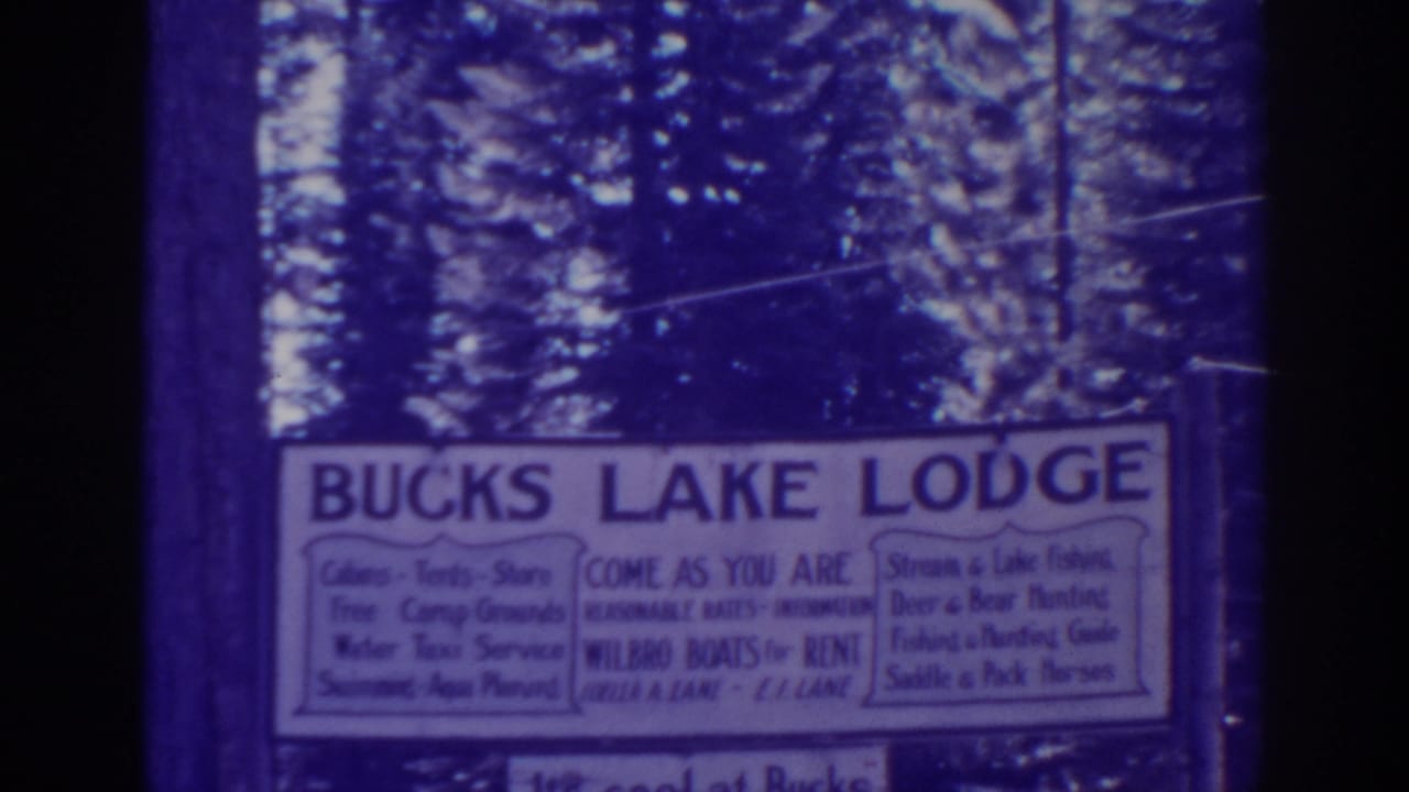Bucks Lake Lodge sign repeated on a soft blue-purple film frame.