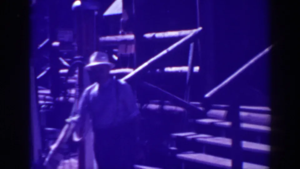 In the final frame, the hatted man continues down the porch stairs in the 1938 Bucks Lake rural scene.