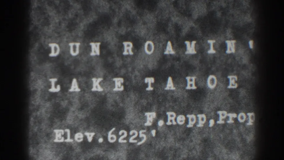 Held title-card frame for Dun Roamin, Lake Tahoe, with F. Repp and elevation 6225 feet visible on grainy 8mm film.