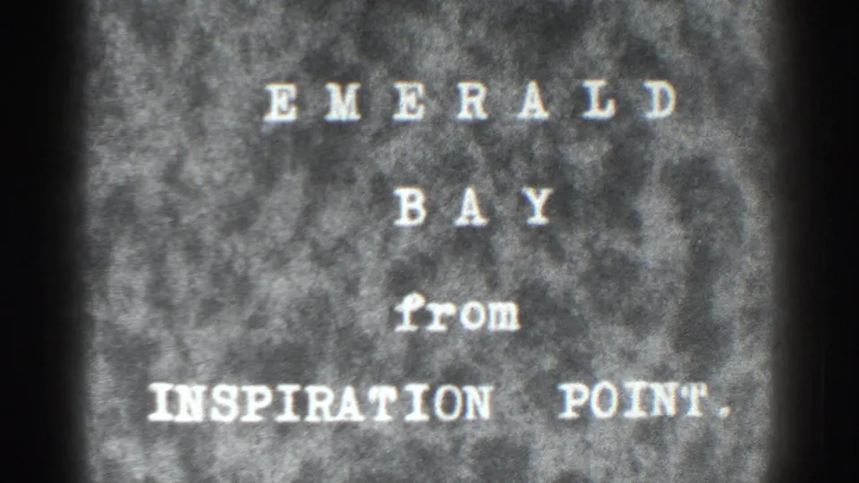 8mm title card reading Emerald Bay from Inspiration Point, filmed with visible grain, soft focus, and dark contact-sheet borders.