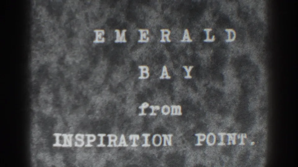Late-1930s 8mm title-card frame showing the words Emerald Bay from Inspiration Point, with soft focus and visible film texture.