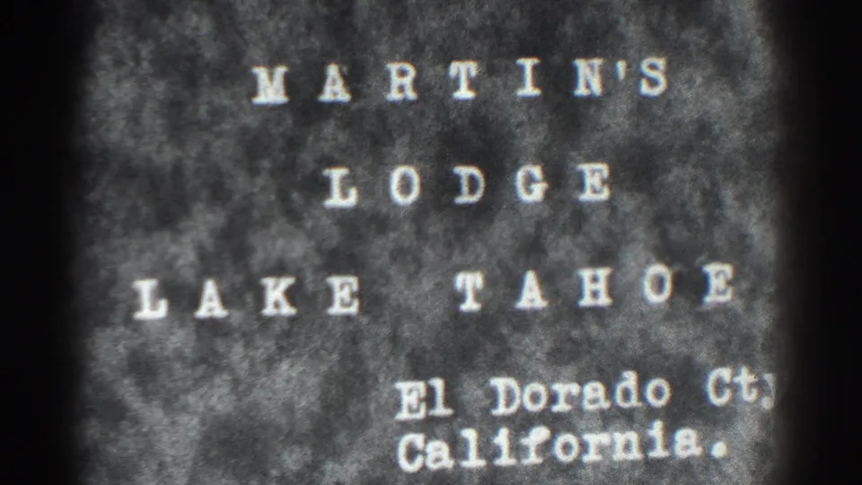 Repeat 1938 title-card frame naming Martin's Lodge at Lake Tahoe in El Dorado County, California, with soft 8mm grain.