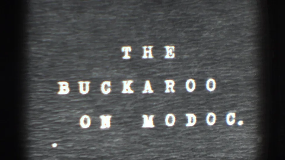 Typewritten-style title card for the 1938 El Dorado City home movie segment, reading The Buckaroo on Mo Doc.