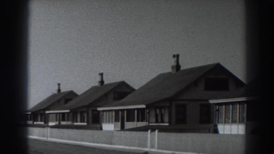 A closer 1938 Fort Ross view shows gabled vacation houses, front windows, chimneys, and fencing near the shoreline.