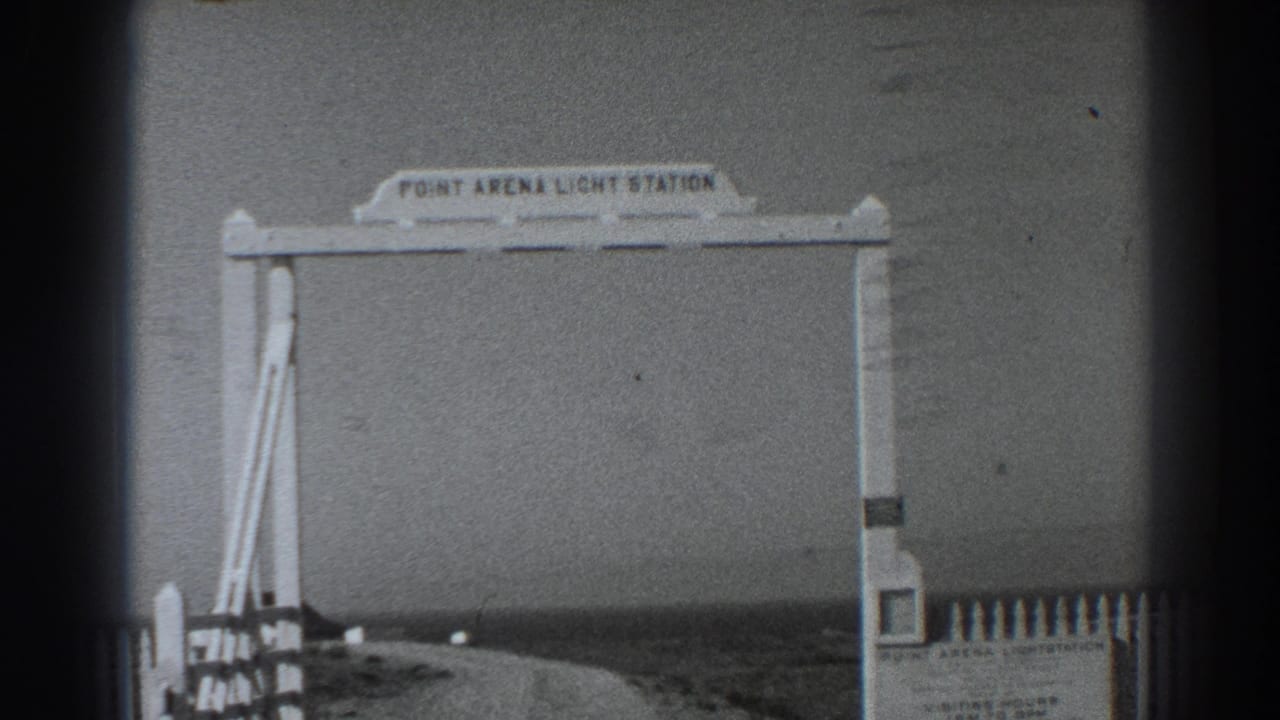 White Point Arena Light Station entrance arch beside a coastal road.