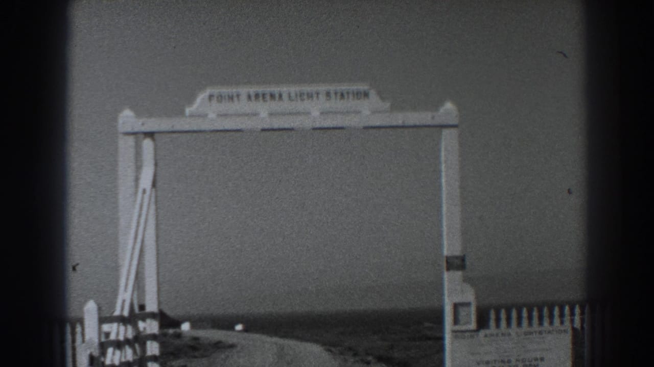 Point Arena Light Station arch over an empty roadside approach.