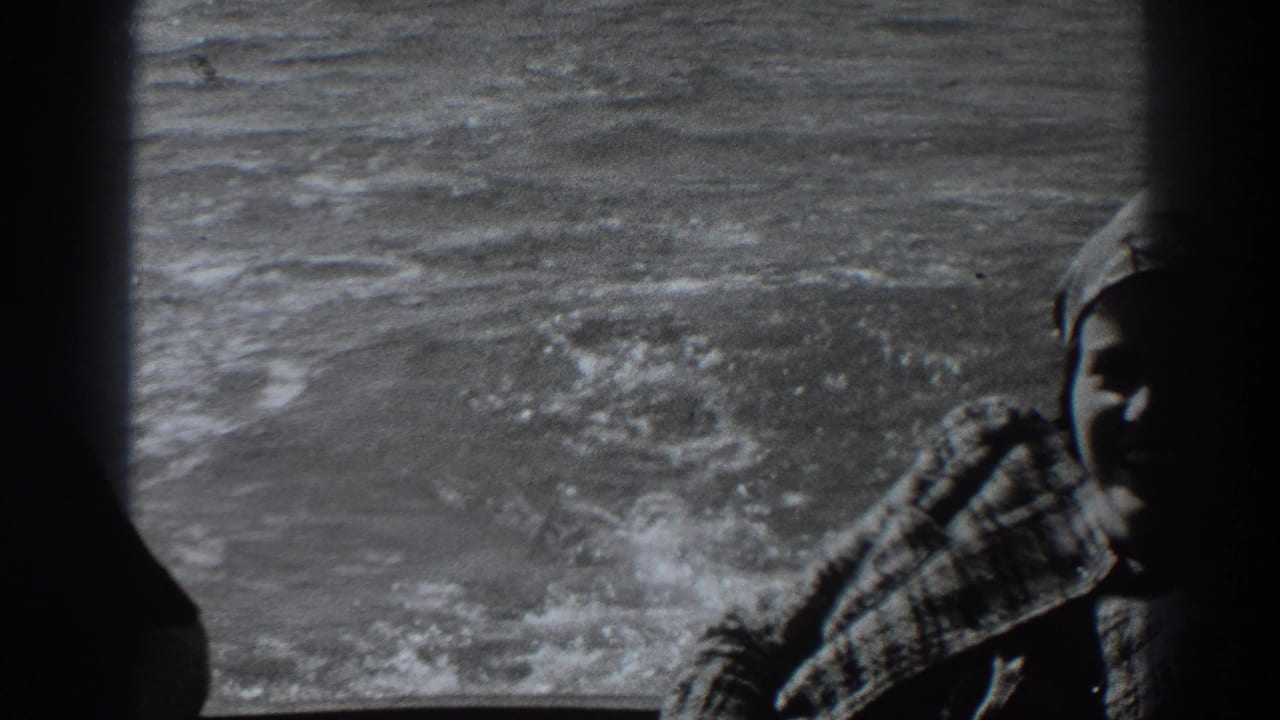 Woman partly cut off at the right edge of a boat window with waves behind her.