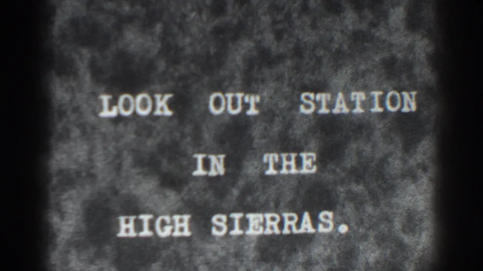 8mm title card identifies the scene as LOOK OUT STATION IN THE HIGH SIERRAS, with white lettering on a mottled dark background.