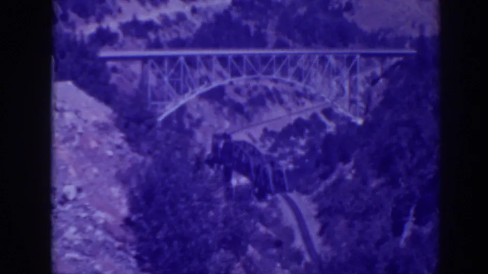 Late-1930s 8mm home-movie view of bridge infrastructure in the Oroville Feather River Canyon landscape.
