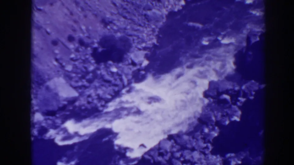 1938 Oroville, California home-movie frame looking down at whitewater flowing through rocks in a rugged canyon.