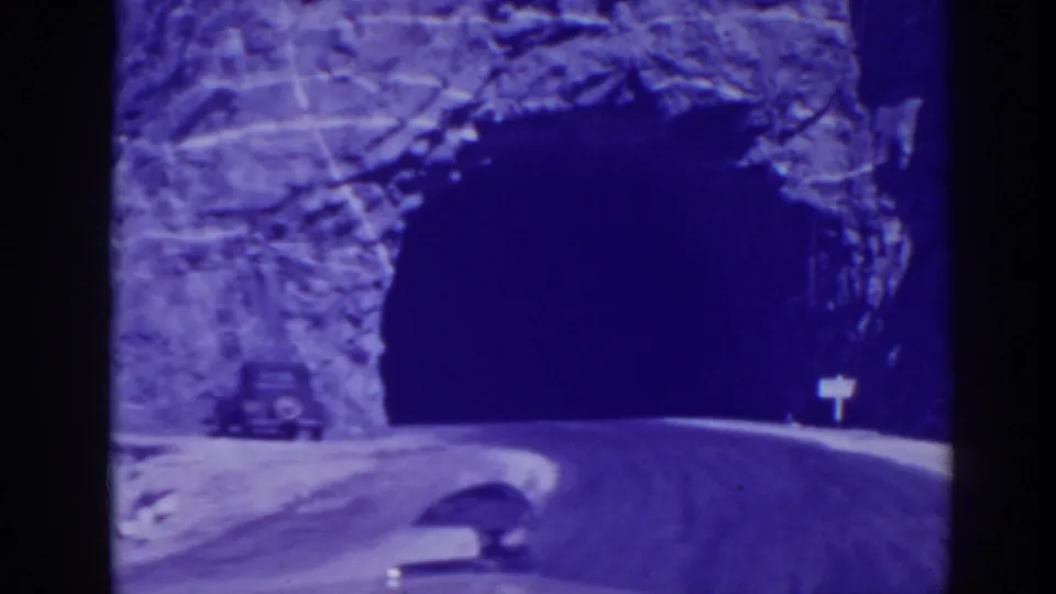 The vehicle reaches the tunnel opening as the road curves into the dark passage in Oroville, California.