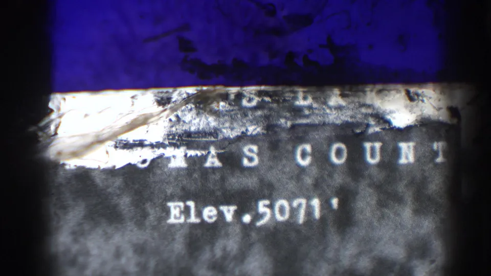 Title card frame shows worn text identifying Buck's Lake in Plumas County with elevation 5071 feet, partly obscured by film damage.