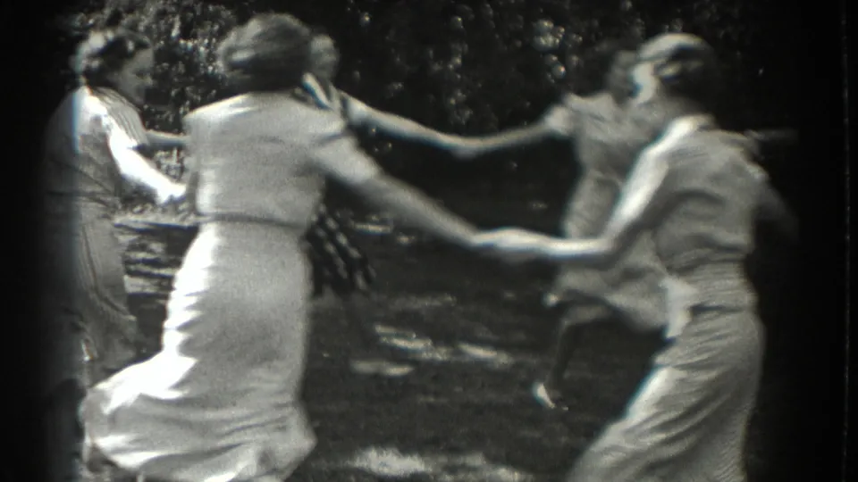In Southampton, New York in 1937, women and teenage girls in dresses appear to play Ring Around the Rosie outdoors.