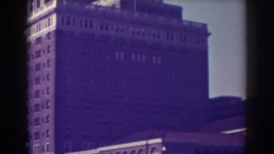 1938 Atlantic City frame showing the building facade, many windows, and a lower arched structure at the street-level foreground.