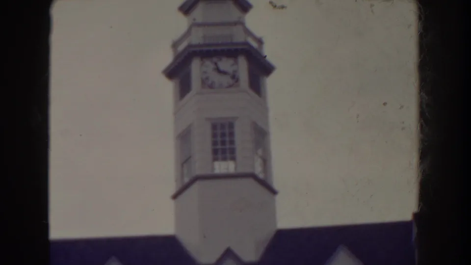 1938 Atlantic City frame showing the clock face and upper portion of a white tower, with dark roofing visible near the bottom edge.