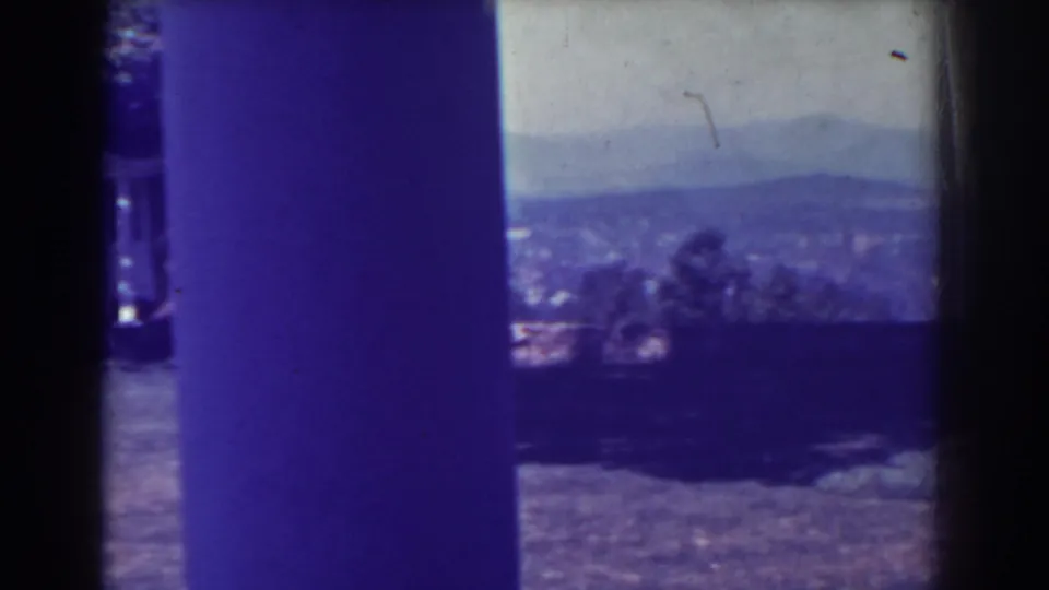Atlantic City, New Jersey metadata frame from 1938 showing a distant valley landscape and low hills through strong 8mm gate edges.