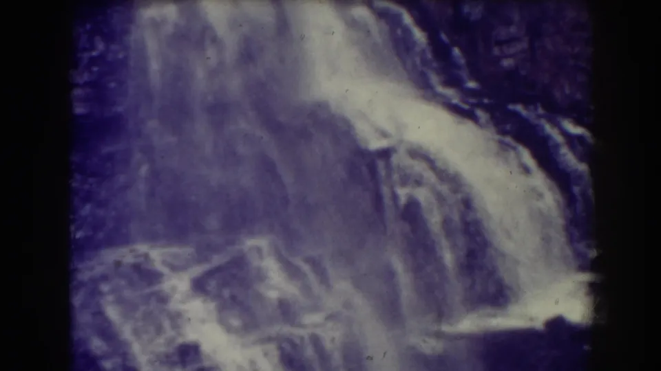 Blackwater Falls in West Virginia appears in faded 1938 8mm footage, with water spilling over layered rock ledges.