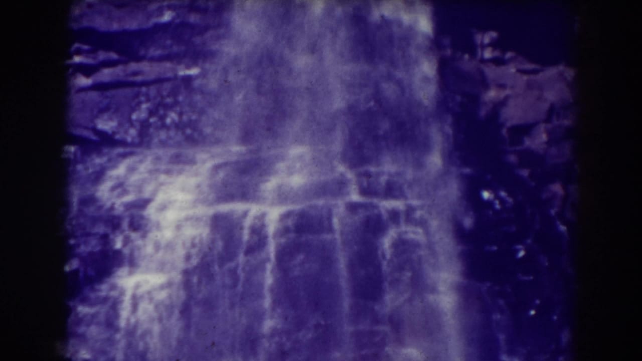 Close 8mm view of Blackwater Falls, West Virginia, with water spreading across layered rock ledges.