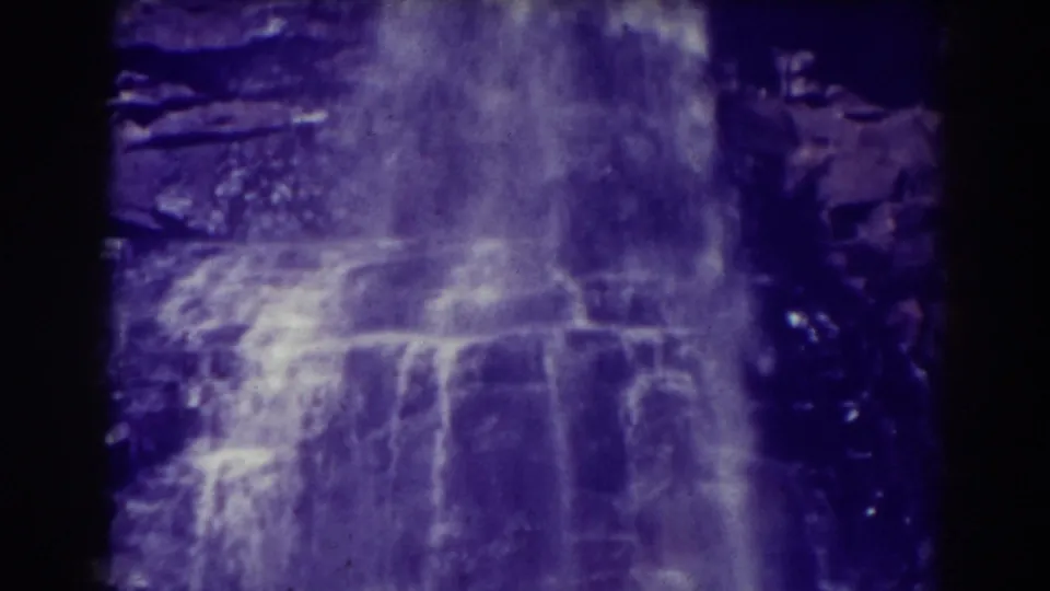 Close 8mm view of Blackwater Falls, West Virginia, with water spreading across layered rock ledges.