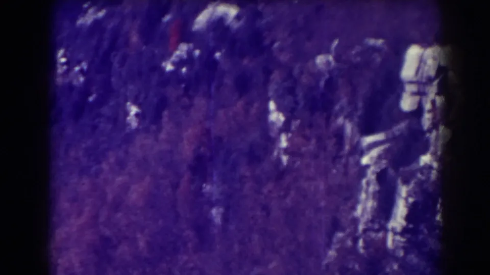 Blackwater Falls, West Virginia landscape frame with dense trees, pale rocks and visible aged-film color fading.