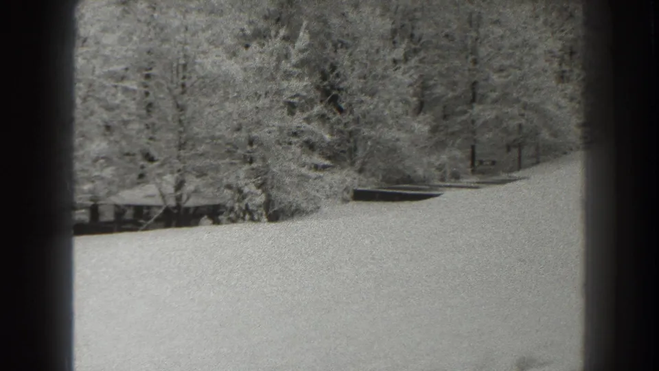 Martinsburg, West Virginia winter landscape from 1938, with snow on a hillside and woods beyond.