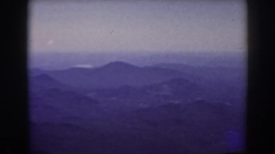 Wide 8mm view from Mount Washington, New Hampshire, showing hazy ridges and valleys in the distance.