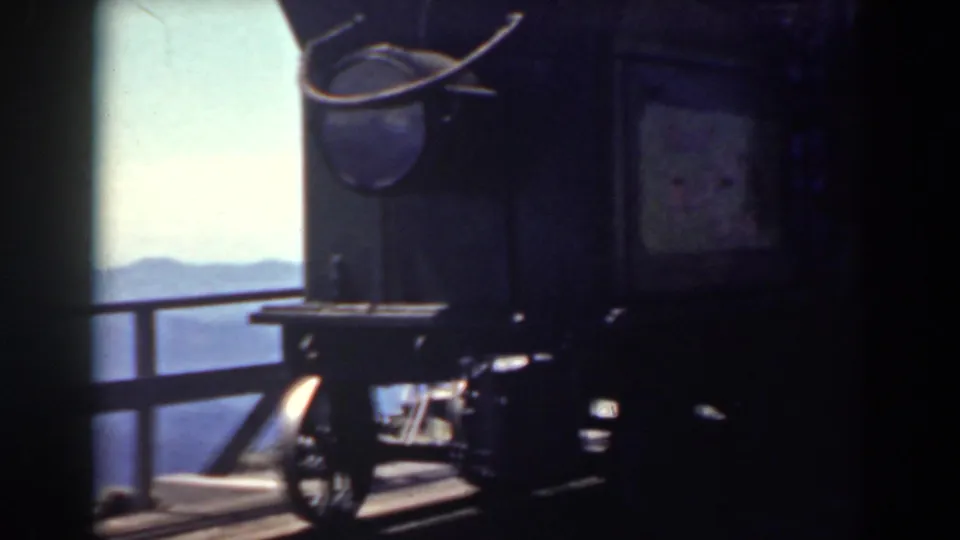 Mount Washington observation structure with railing, hanging object, and distant mountain view in 1938 8mm footage.