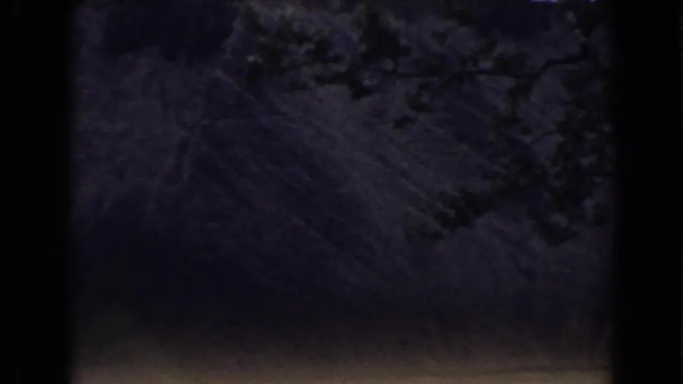 1938 8mm Mount Washington footage begins with a dim wooded view and heavy shadow before the dam spillway appears.