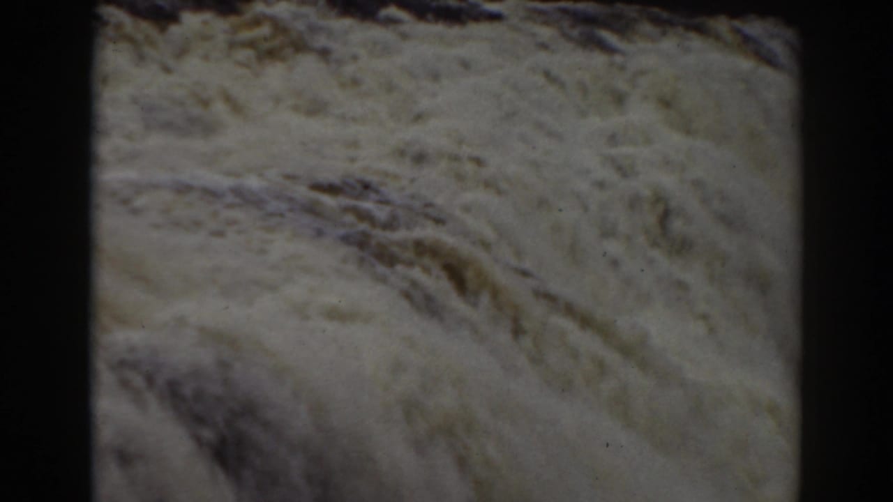 Foaming current spreads across the frame in this 1938 Mount Washington home-movie view of the falls.
