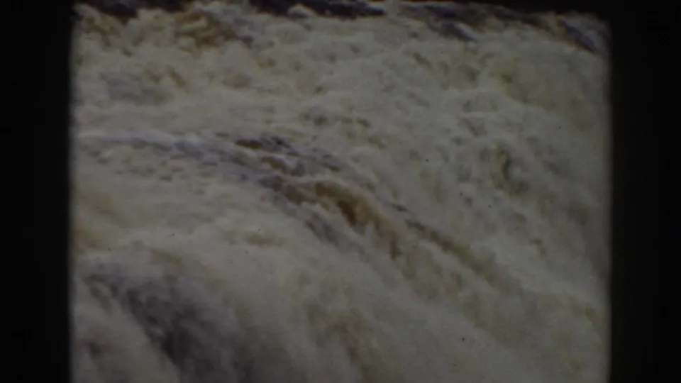 Foaming current spreads across the frame in this 1938 Mount Washington home-movie view of the falls.