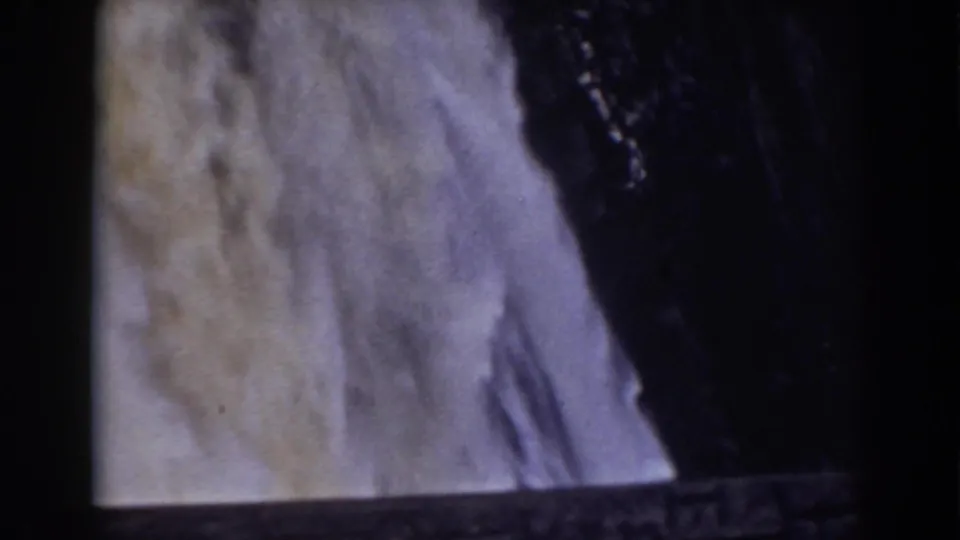 1938 8mm view near Mount Washington showing a waterfall plunging past dark rock into mist.