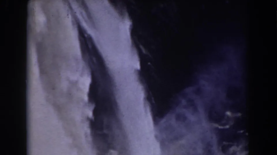Mount Washington area waterfall in 1938 home-movie footage, seen close against dark rock and mist.