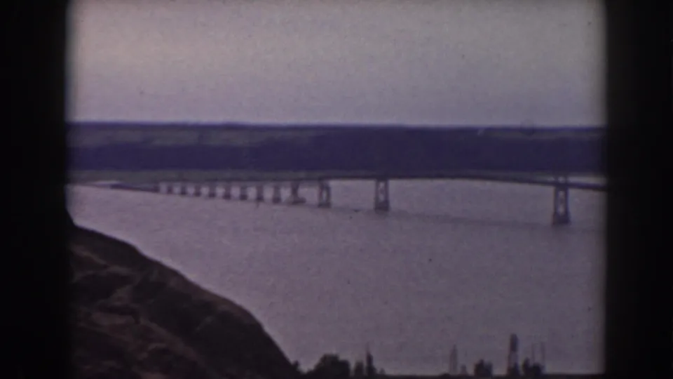 1938 8mm frame showing a bridge over water from a rocky overlook in the supplied Mount Washington, New Hampshire travel footage.