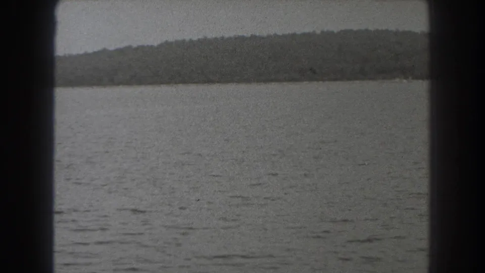 1938 New Jersey 8mm view of broad gray water and a distant wooded horizon, held in a steady observational home-movie frame.
