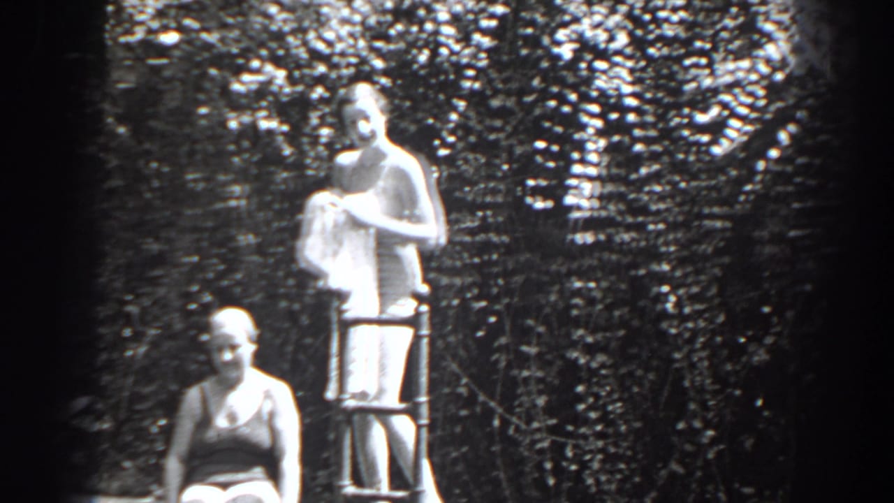 1938 New Jersey frame with a standing woman holding a towel at a metal ladder and a seated woman below.