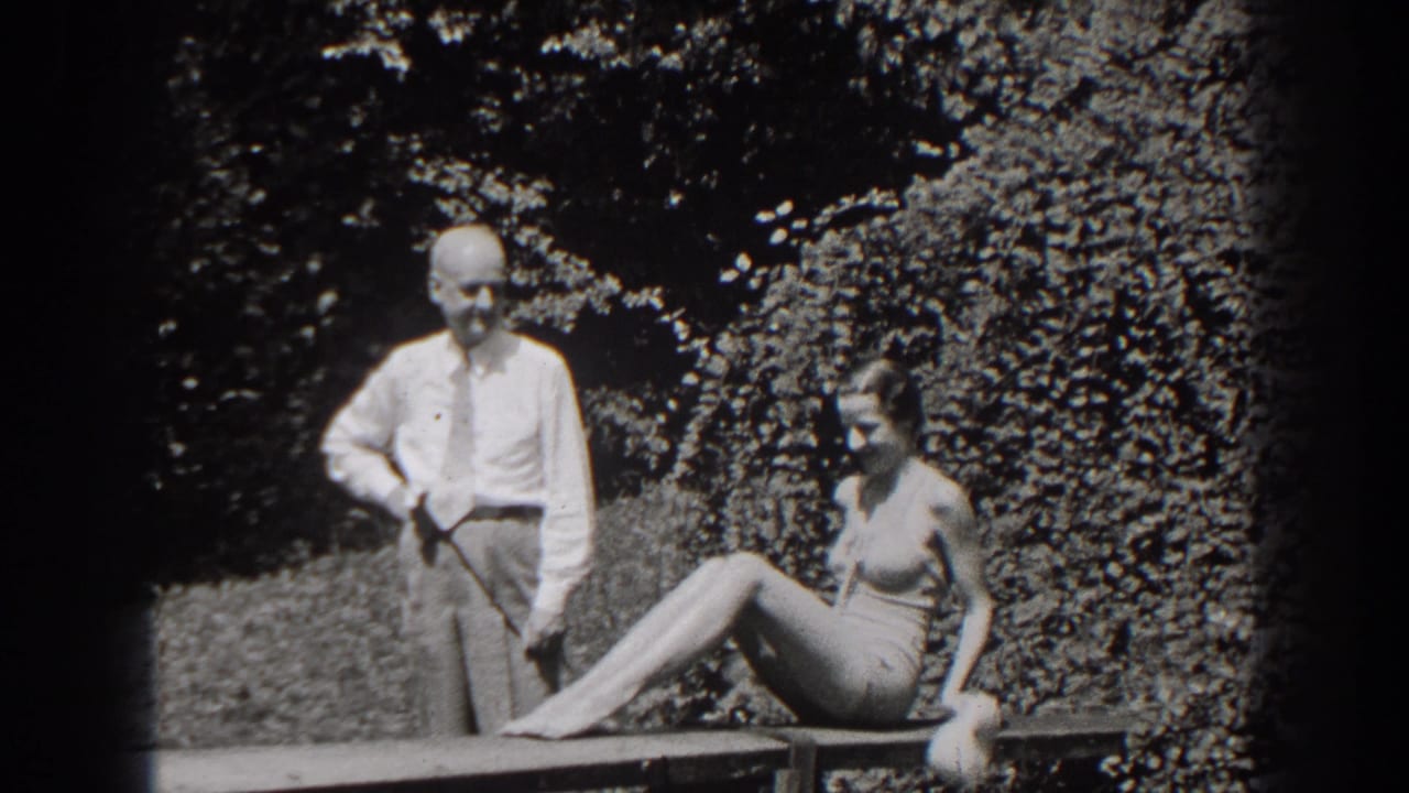 In the final frame, the woman extends her legs along the garden bench while the man stands beside her against the hedge.