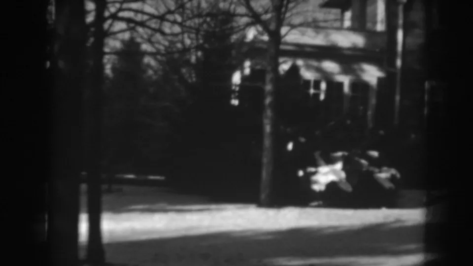 The final frame shows dark trees, strong shadows, a bright path, and a partial building or garden structure within the same Winchester outdoor scene.