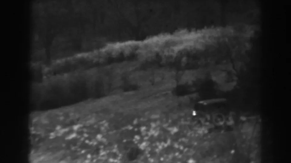 1938 rural Maryland frame with a parked early automobile partly obscured by bright foliage on a sloping lawn.