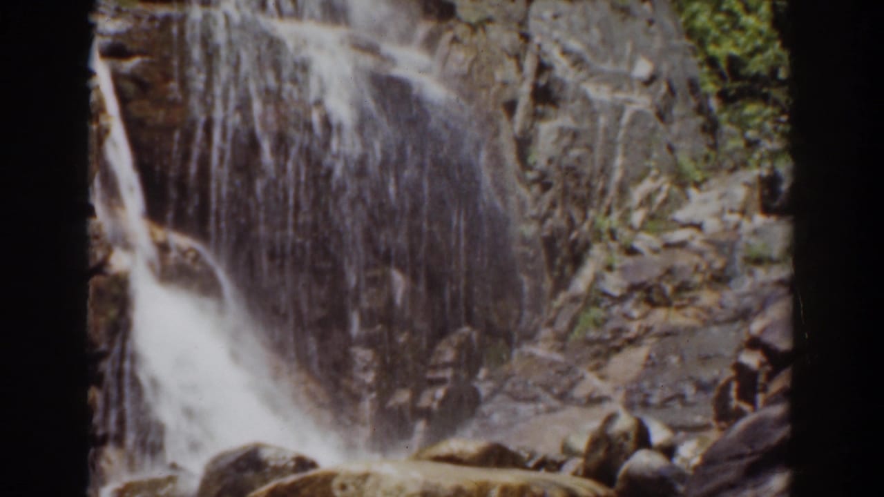 A final 1939 Mount Washington frame holds on the waterfall, rock face, and surrounding greenery.
