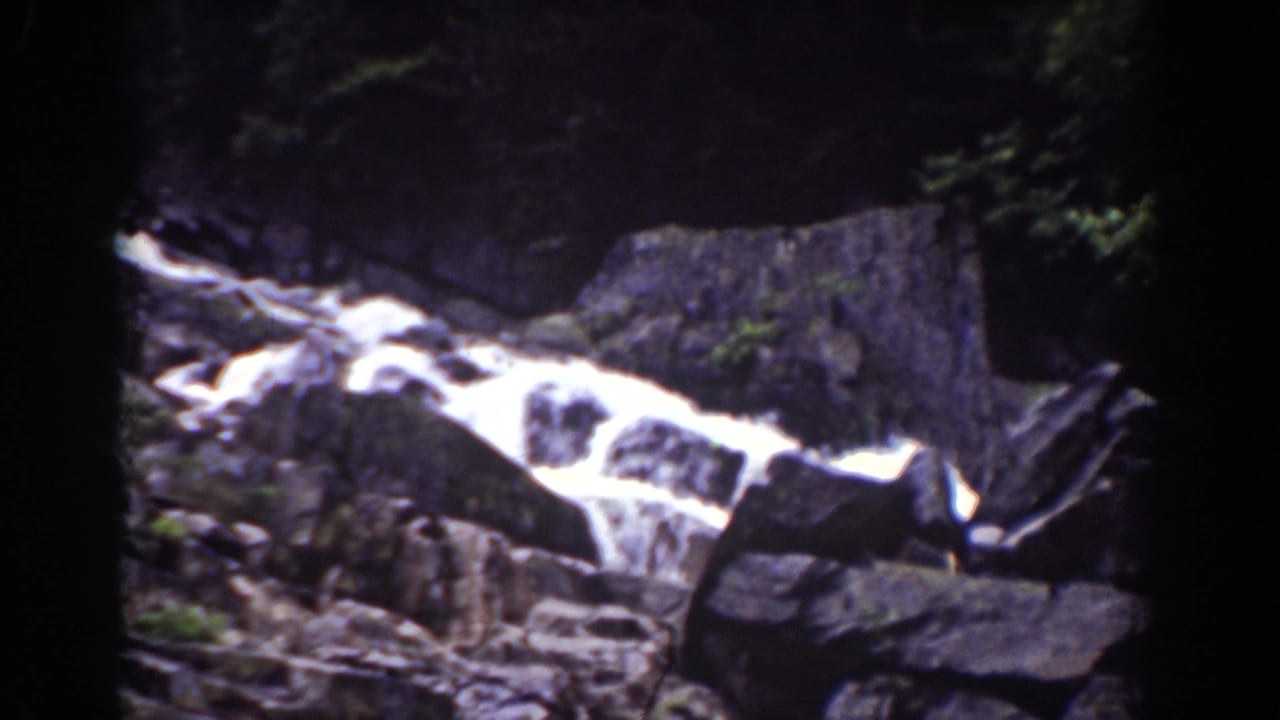 Rocky waterfall in the Mount Washington, New Hampshire area, captured in soft 1939 8mm home-movie color.