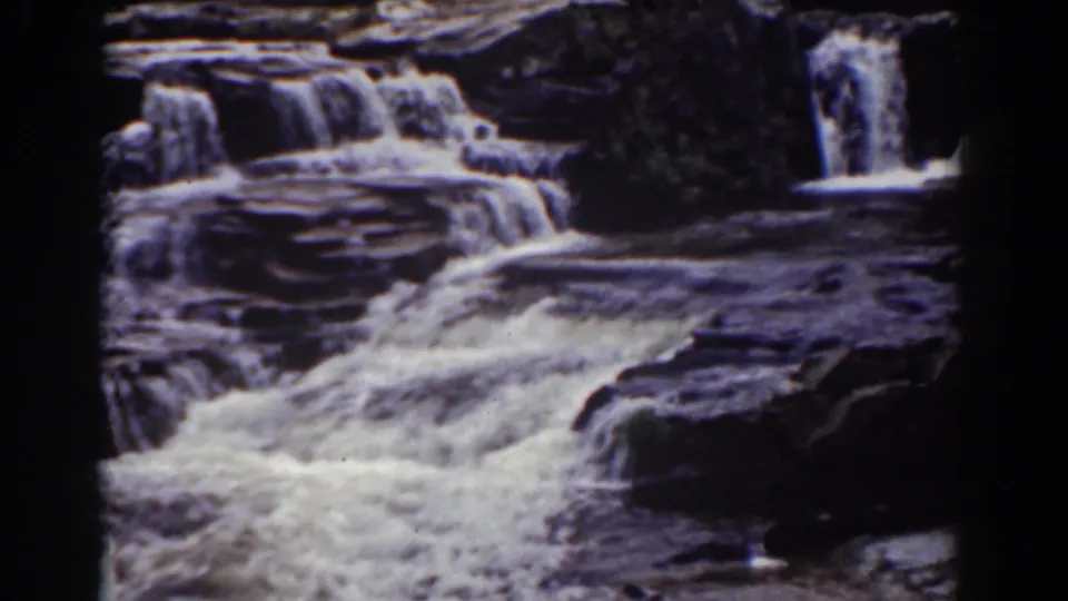 Mount Washington, New Hampshire waterfall footage from 1939 showing bright water cascading across layered dark rock.