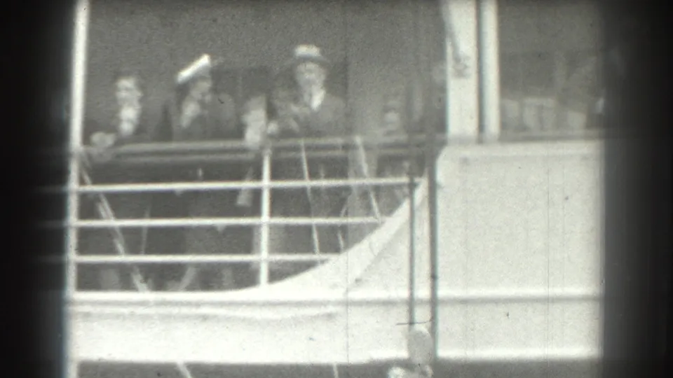 1939 San Francisco home-movie view of passengers and a uniformed-looking figure behind a ship deck railing.