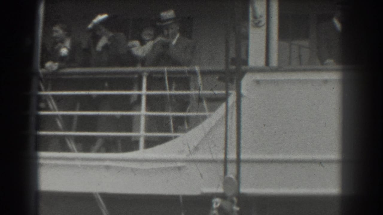 Several passengers stand near ship railings and windows, partly obscured by frame edges.