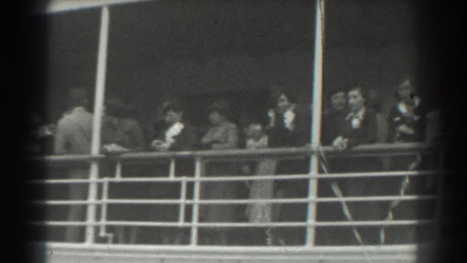 Shipboard passengers in suits, dresses, and hats are filmed from a distance in 1939 San Francisco archival home-movie footage.