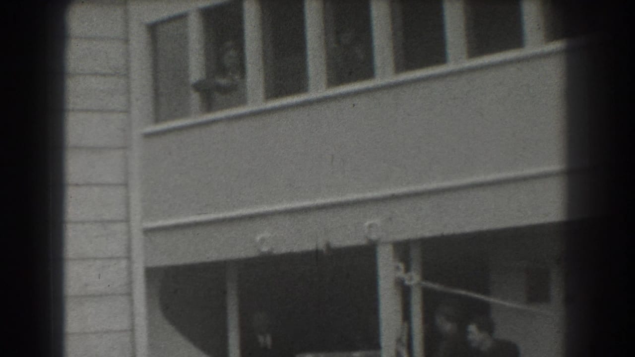 Ship exterior with upper windows and partial lower deck opening.