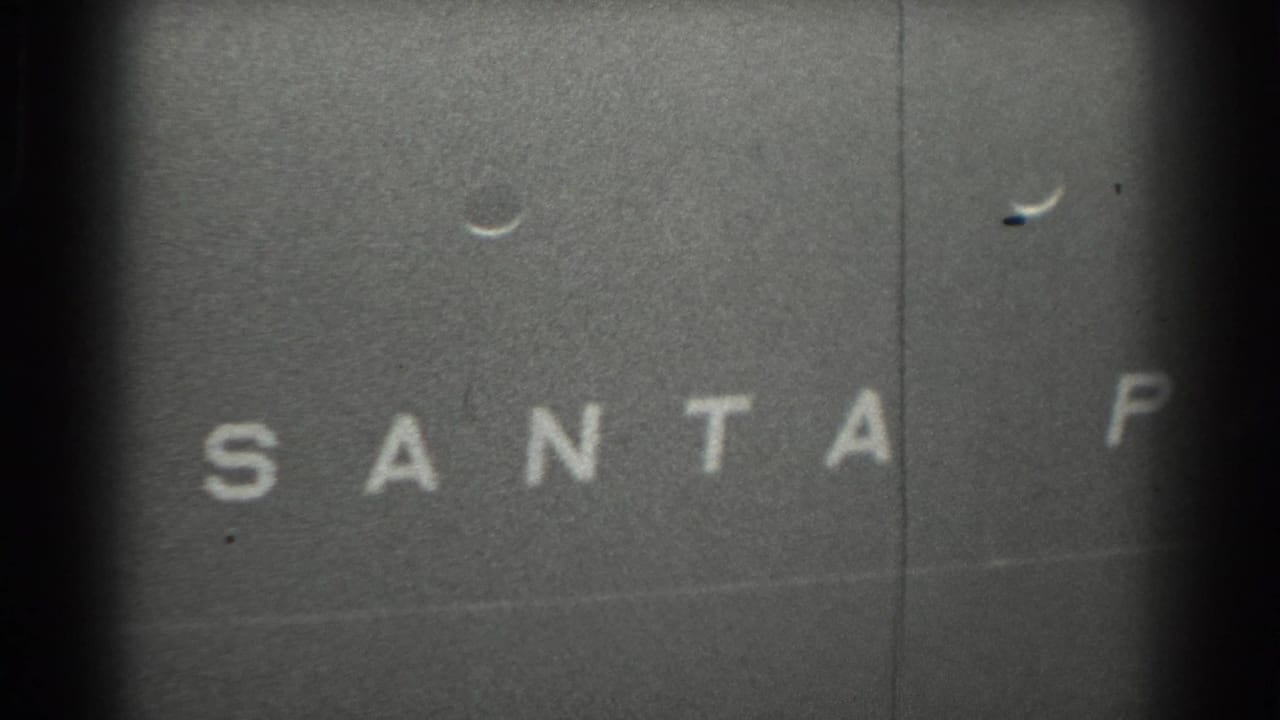 1939 San Francisco 8mm frame showing white block letters from the name Santa Paul on a dark vessel surface.