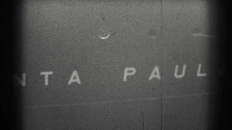 1939 San Francisco 8mm frame with Santa Paul lettering visible across a dark vessel surface, with grain and scratches.